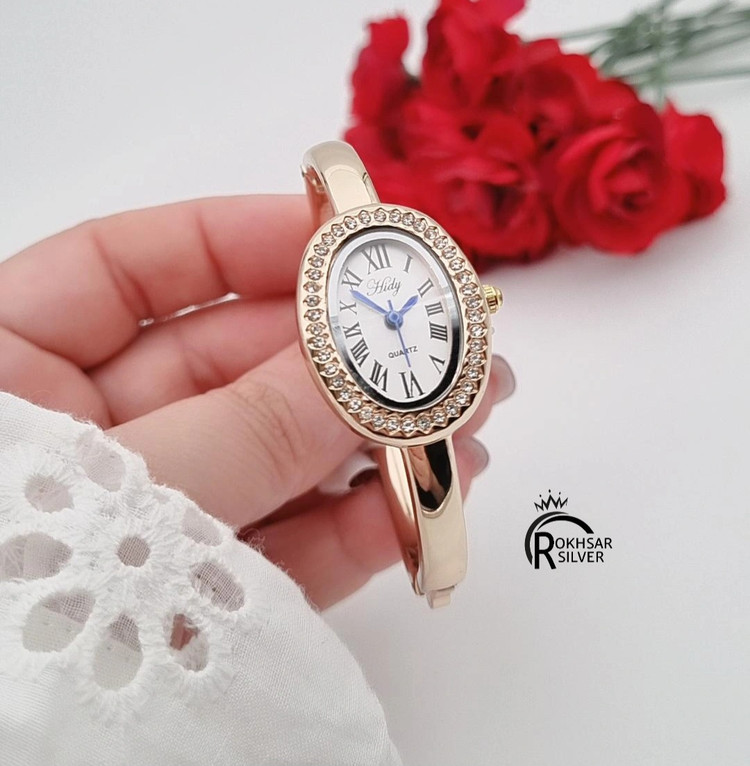 ساعت مچی زنانه طلایی مدل النگویی با صفحه بیضی و ایندکس رومی کدRS_2435